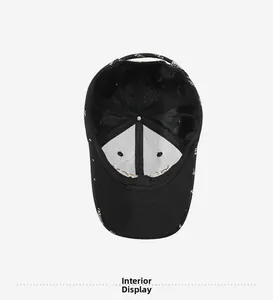 Interior view of black baseball cap showing breathable fabric and inner support lining