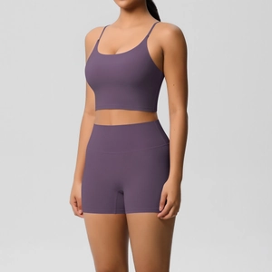 Detail of mulberry purple yoga set featuring thin straps sports bra and high-waist shorts