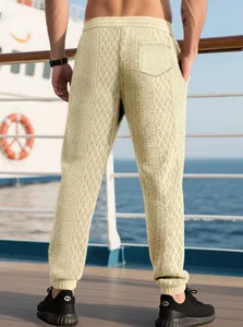 Men's waffle knit joggers featuring beige diamond texture and elastic drawstring waistband