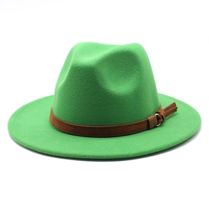 Close-up of the bright green felt fedora hat featuring a brown buckled leather band