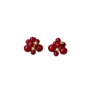Elegant red resin fireworks stud earrings with gold plating and cubic zirconia accents