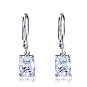 Macro detail of silver lever-back earrings with cushion-cut cubic zirconia and fine claw setting