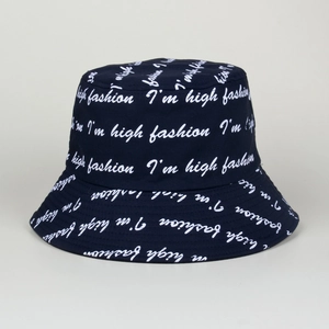 Close-up of navy bucket hat with white I'm high fashion cursive lettering detail