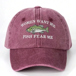 Close-up of white embroidery on a wine red washed cotton baseball cap with fish pattern