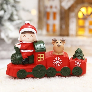 Festive cartoon Christmas train figurine with Santa girl and reindeer decoration
