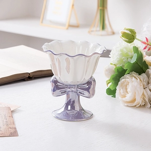 Elegant purple ceramic bow sundae cup on a white wooden table with soft morning lighting