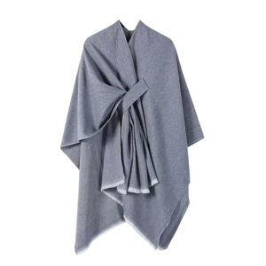 Elegant grey herringbone poncho for women with fringe edge and stylish knot details