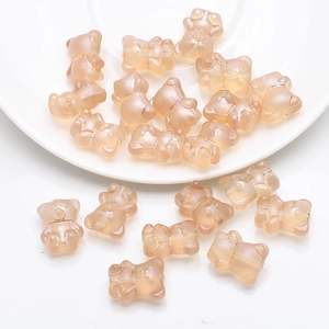 Macro shot of 12x14mm translucent resin bear beads for DIY jewelry and crafts in soft flesh pink
