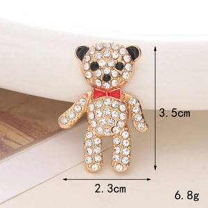 Sparkling rhinestone bear charm in gold with red bowtie, size 3.5cm by 2.3cm