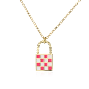 Detail of gold necklace with a red and white checkerboard pattern mini bag pendant