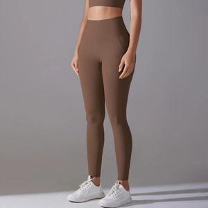 Side view of high-waist fitness leggings in deep brown with smooth seamless texture
