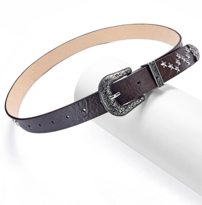 Detail of dark brown PU belt with vintage silver star rivets and engraved buckle