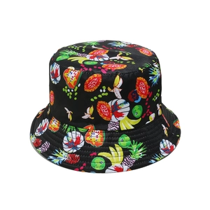 Detail shot of black bucket hat featuring vibrant colorful pineapple and fruit prints