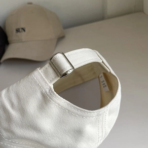 White minimalist cotton baseball cap with adjustable metal buckle and SUN embroidery