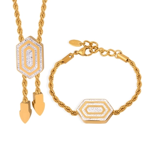 Elegant gold titanium steel jewelry set featuring a hexagonal pendant with zirconia stones