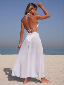 Sexy white three-piece bikini set with a long sheer mesh beach cover-up skirt for women