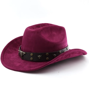 Detail of burgundy suede cowboy hat featuring leather band with bull head metal studs