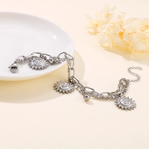 Double-layered stainless steel chain bracelet featuring silver sun face charms and lobster clasp