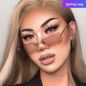 Detail of rimless square sunglasses with brown gradient lenses and spring hinges on model