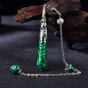 Malachite hexagonal pendulum necklace with silver dragon cap and dark textured background