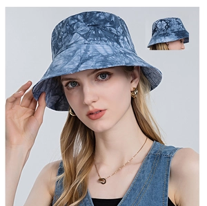 Detailed view of blue and white tie-dye bucket hat with textured cotton fabric