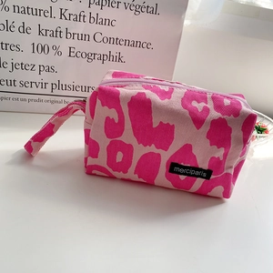 Detail of pink leopard canvas pencil case with merciparis label and metal zipper