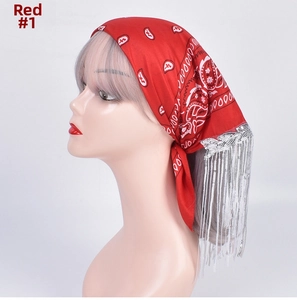 Detail of red paisley bandana with silver leaf sequins and long fringed chain on model