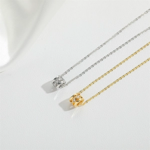 Exquisite gold and silver necklaces with quilted cylinder pendants and sparkling zircons