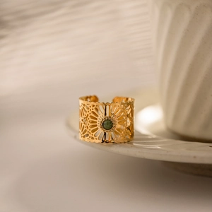 Bohemian gold plated open ring with hollow carvings and a green gemstone center