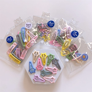 Detail view of 10-piece mini square and star candy-colored metal hair clips set for girls
