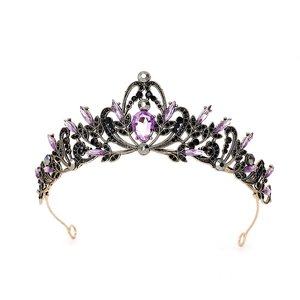 Macro shot of baroque tiara with vintage bronze carving and purple teardrop crystals