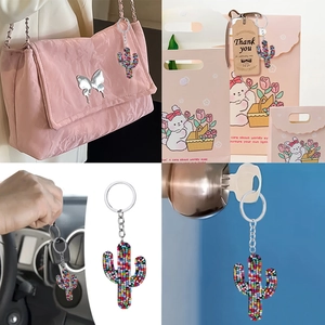 Beaded cactus keychain charm displayed as a stylish bag accessory and gift tag