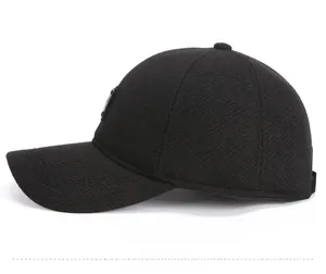 Side profile of men's winter thermal baseball cap featuring thick wool-like textured fabric