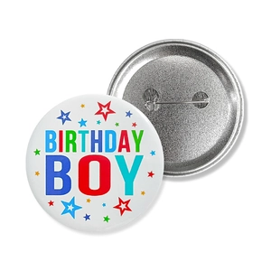 Front and back view of colorful Birthday Boy party badge with safety pin detail