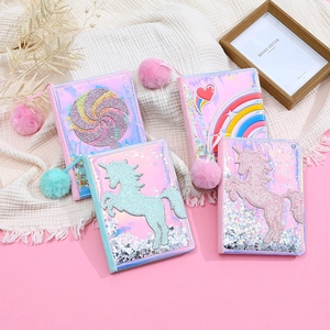 Flat lay of colorful A5 PU notebooks with cartoon sequins, glitter, and plush bookmarks