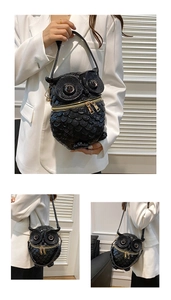 Detailed views of creative black owl-shaped crossbody bag with gold metallic accents