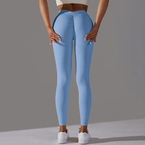 Close-up of sky blue high-waisted yoga pants with ruched seam for butt-lifting effect