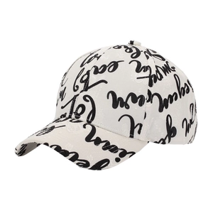 Detail shot of a white baseball cap with black graffiti letters and street style print