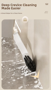 Close-up of deep crevice cleaning brush with stiff bristles scrubbing tile grout