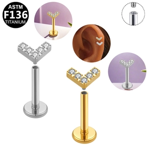 Detailed view of ASTM F136 titanium threaded studs with V-shape zircon settings