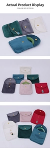 Detail view of premium velvet jewelry pouches with snap closure in various elegant colors
