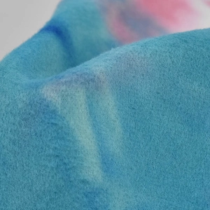Macro shot of blue tie-dye felt wool fabric showing soft texture of wide brim fedora