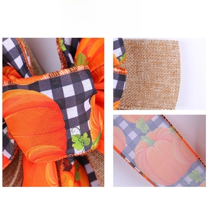 Detailed texture of fall harvest ribbon with pumpkin patterns and gingham burlap backing