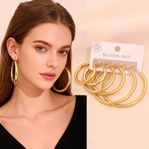 Detailed set of six different sizes of polished gold stainless steel hoop earrings