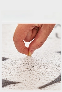Close-up of soft high-elastic white silk loop mat showing sand and dust removal texture