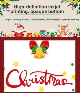 Detail of Christmas PVC sticker showing golden bells and holly leaves with red text