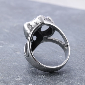 Vintage silver punk skull ring with distressed metal texture and viking animal motifs