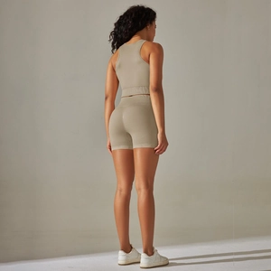 Detail of seamless knitted racerback sports top and high waist shorts set for fitness