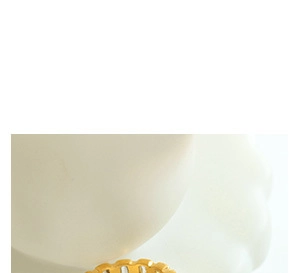 Close-up of a minimalist golden wavy ring featuring a polished hollow curve design