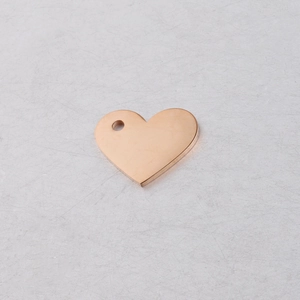 Macro shot of rose gold hollow heart pendant with smooth finish and hanging hole